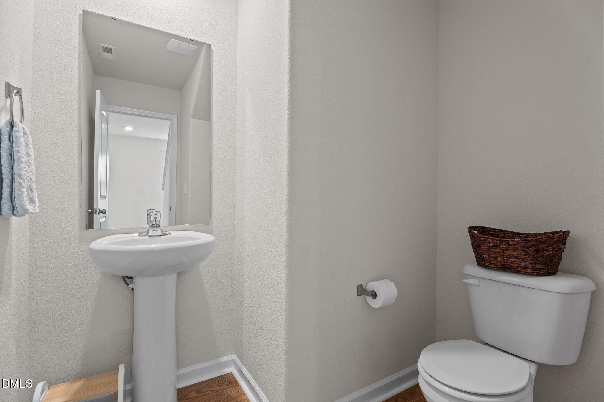 357 Gourd Street Zebulon, NC 27597 - Photo 13 of 50 a bathroom with a sink toilet and a mirror