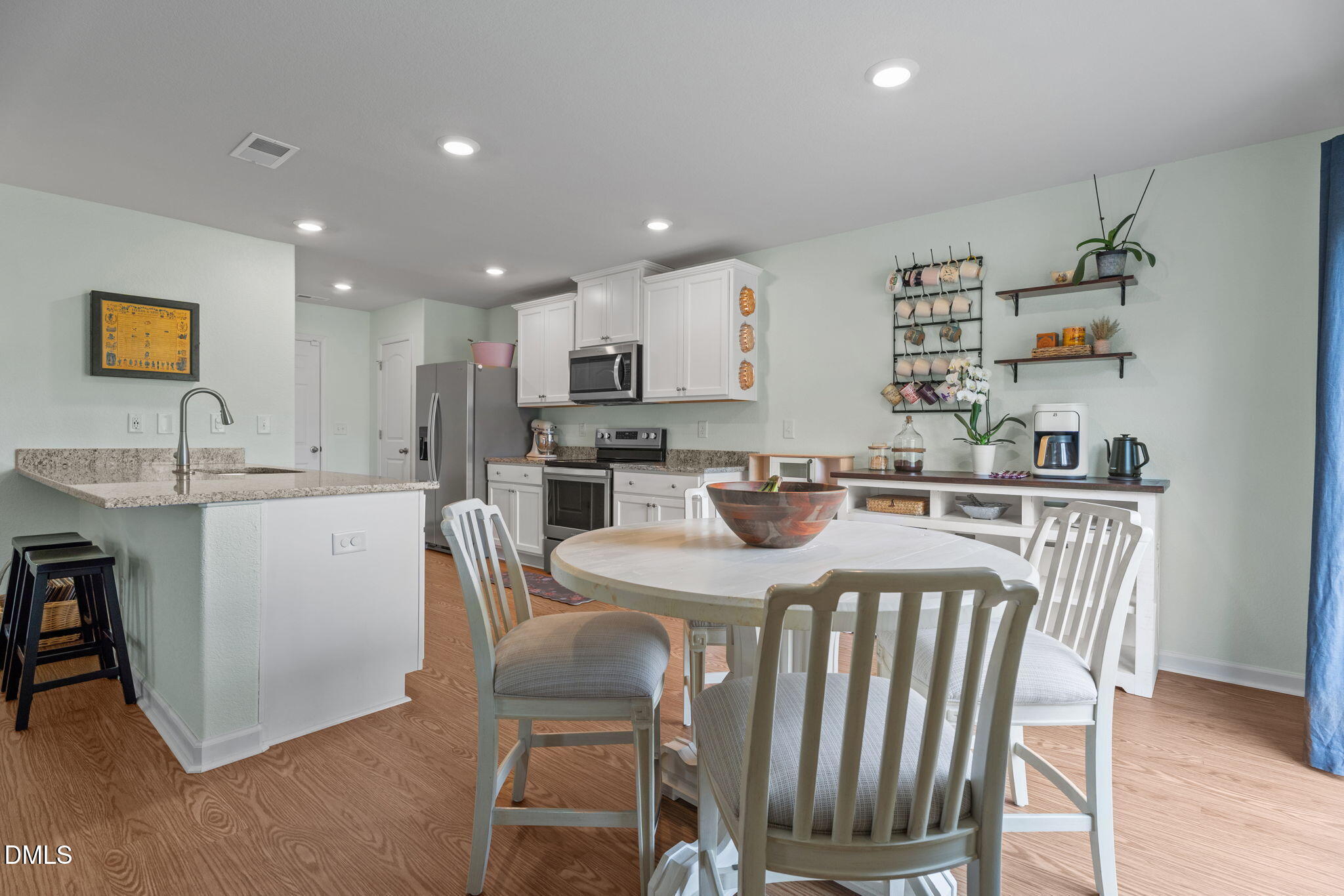 357 Gourd Street Zebulon, NC 27597 - Photo 17 of 50 a view of kitchen with cabinets and wooden floor