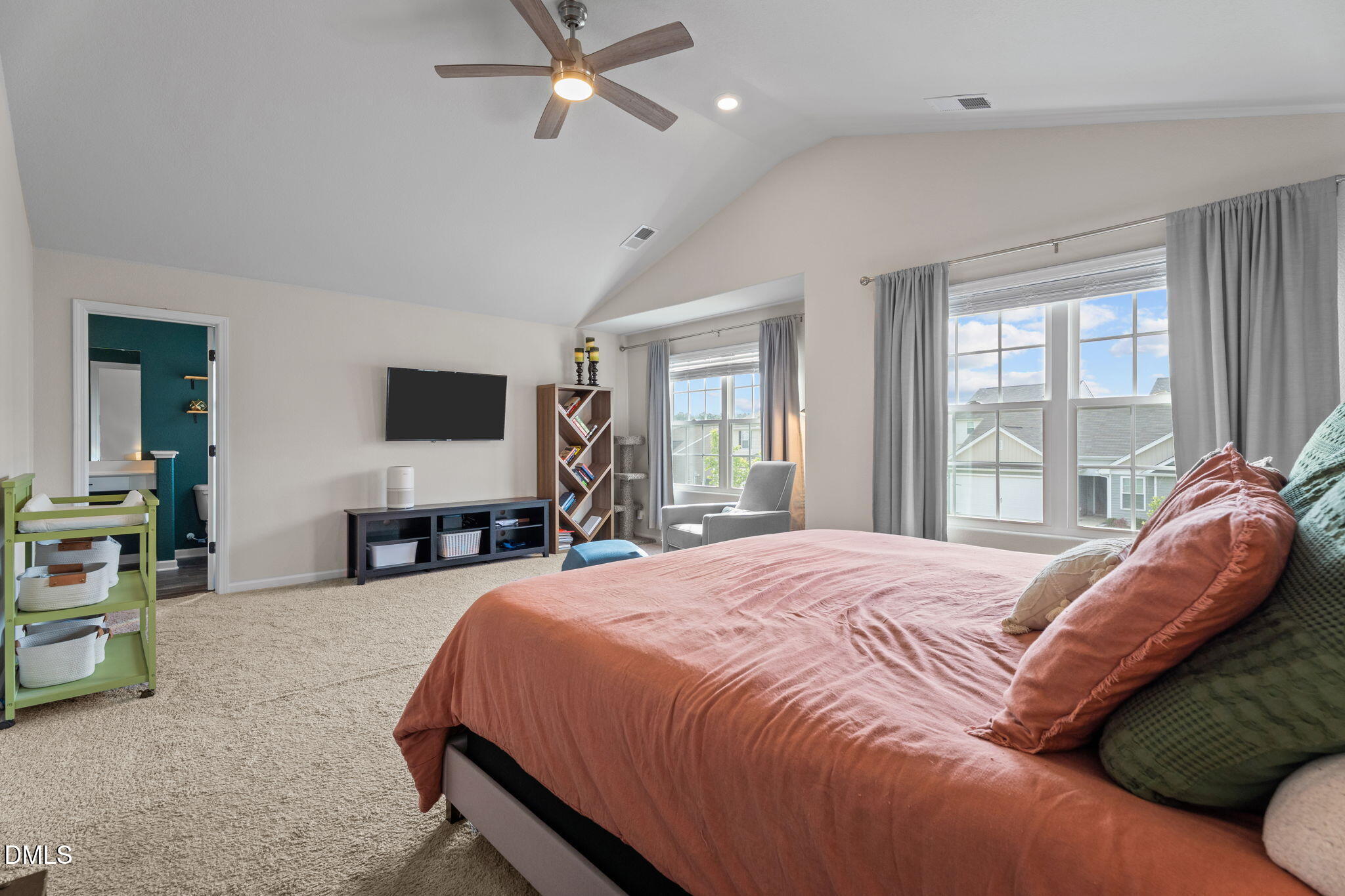 357 Gourd Street Zebulon, NC 27597 - Photo 26 of 50 a bedroom with a bed and a flat tv screen