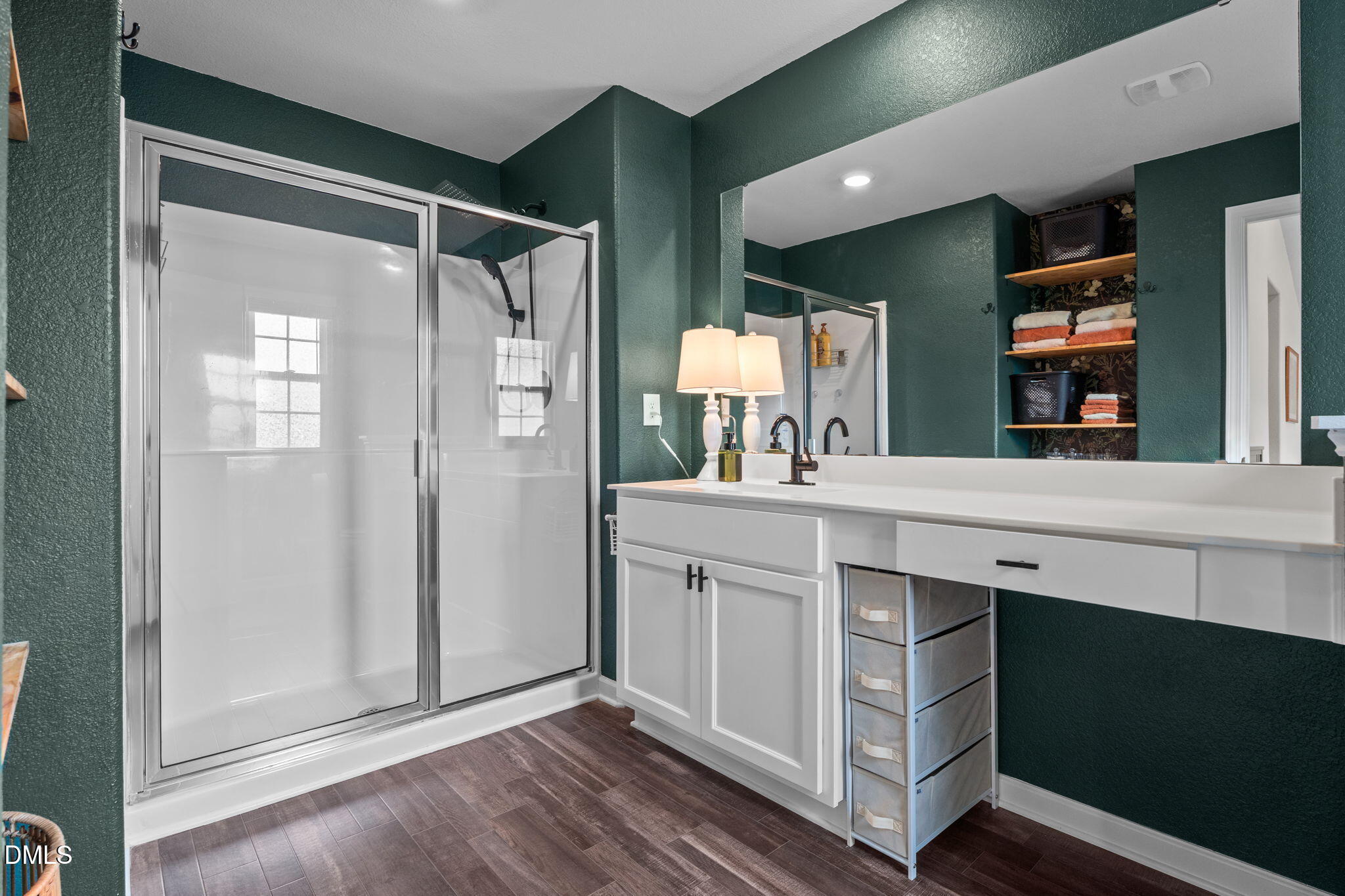 357 Gourd Street Zebulon, NC 27597 - Photo 27 of 50 a spacious bathroom with a shower sink and mirror