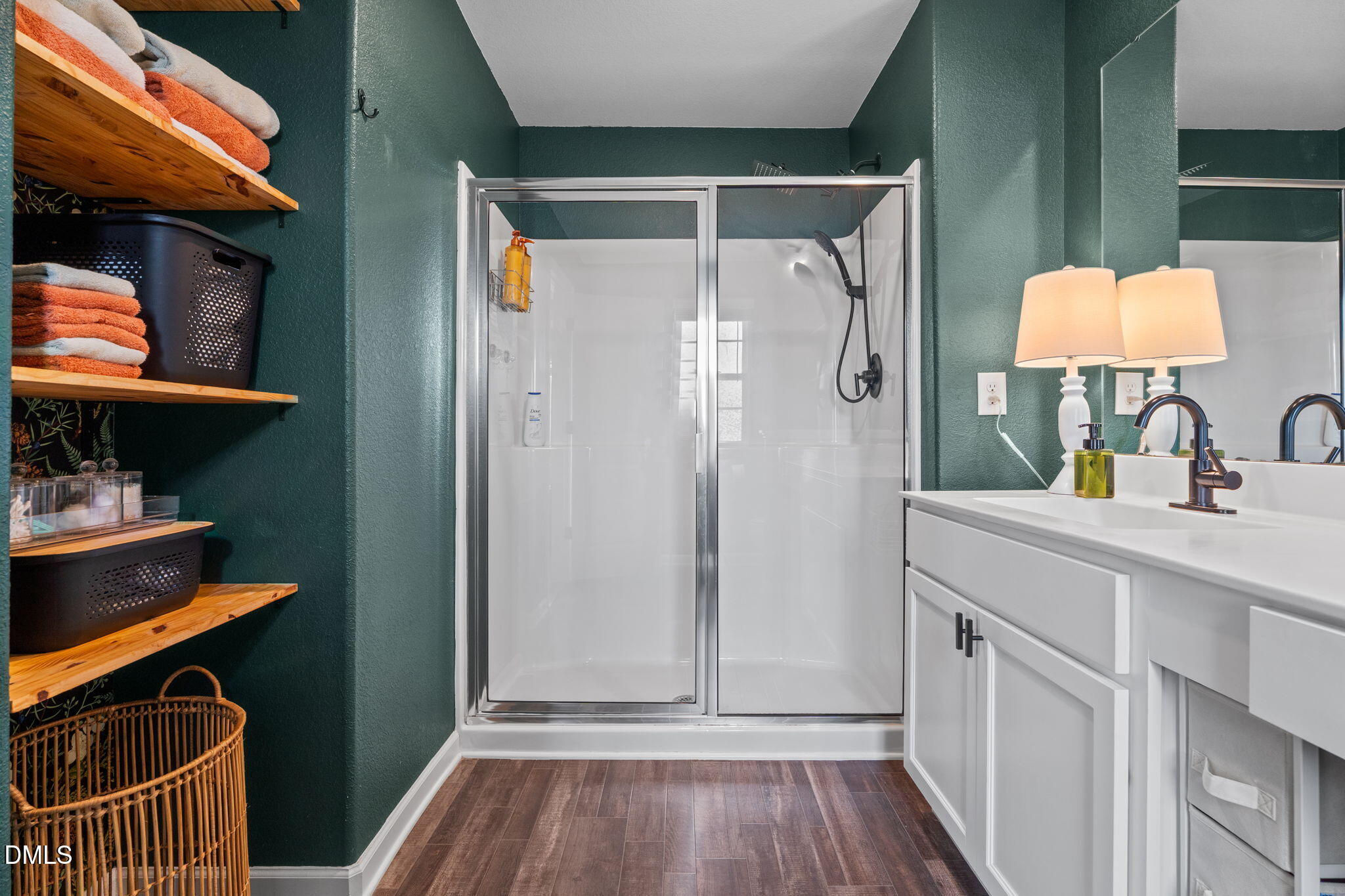 357 Gourd Street Zebulon, NC 27597 - Photo 28 of 50 a bathroom with a sink a mirror and shower