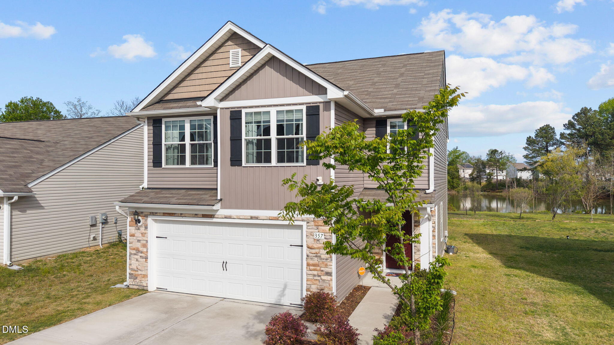 357 Gourd Street Zebulon, NC 27597 - Photo 3 of 50 a view of a house with a yard and plants