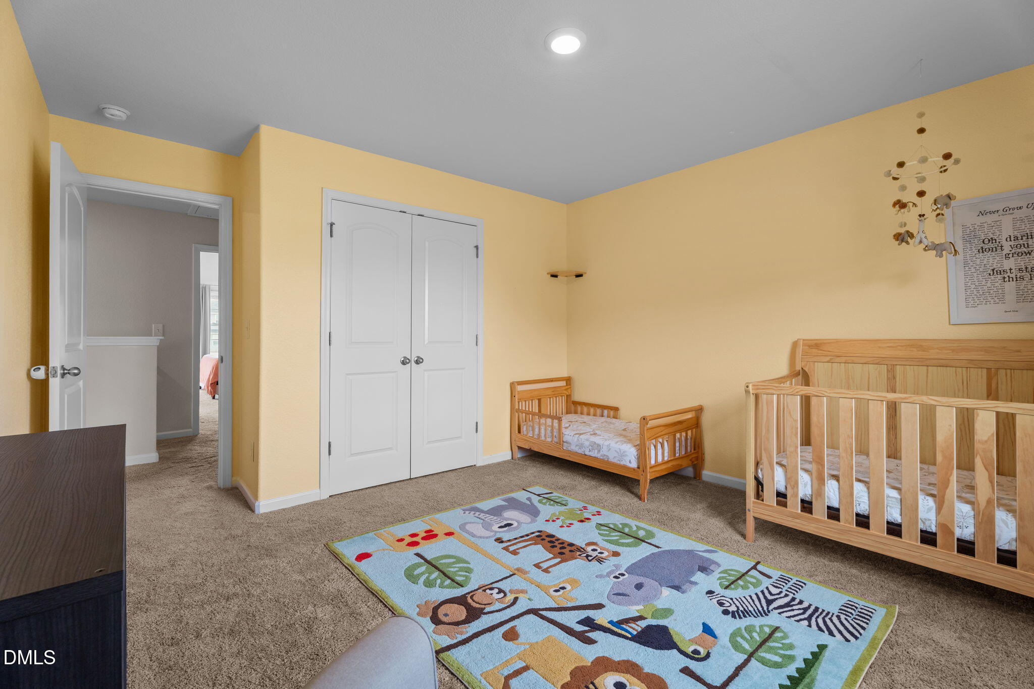 357 Gourd Street Zebulon, NC 27597 - Photo 32 of 50 a view of a bedroom with furniture and rug