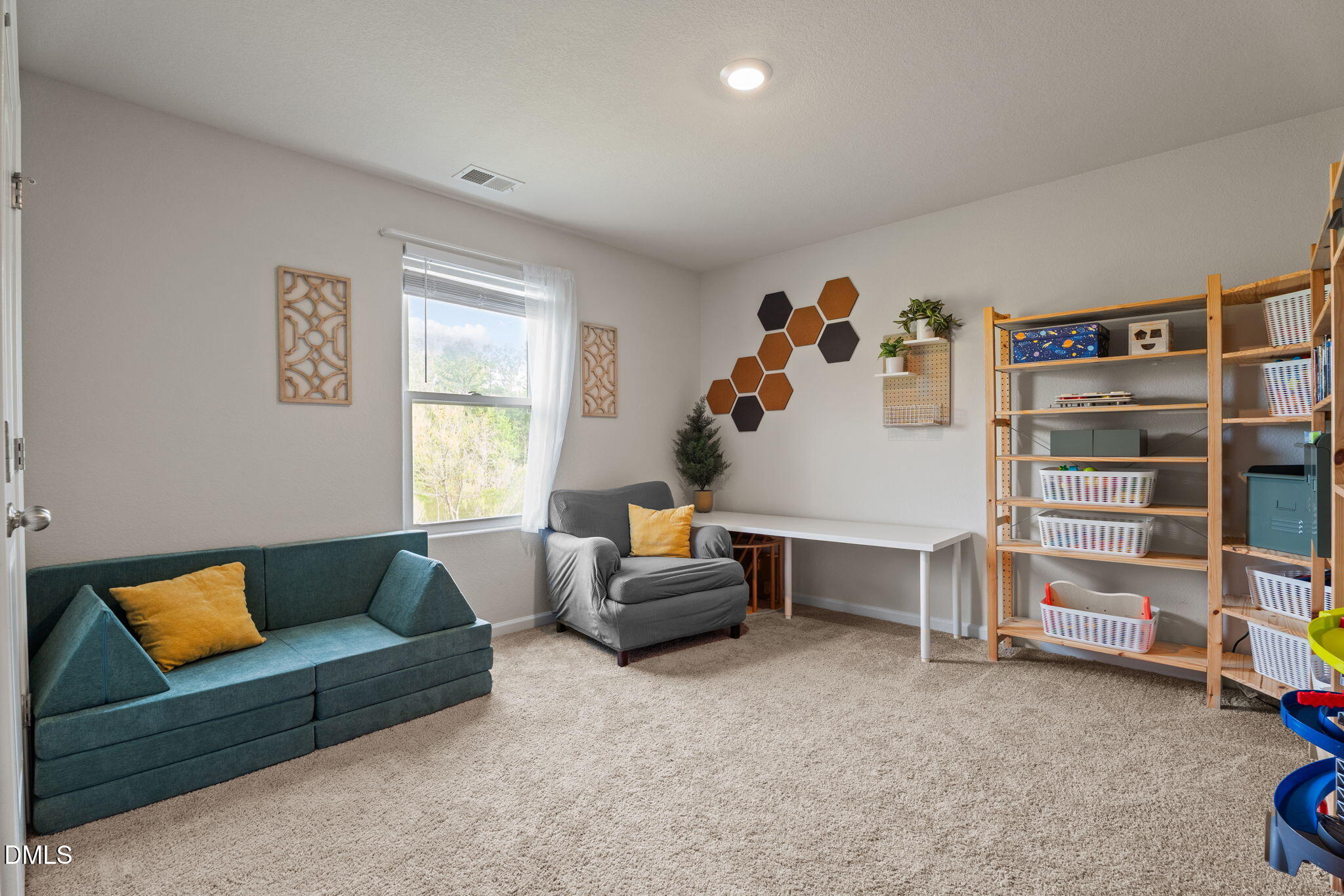 357 Gourd Street Zebulon, NC 27597 - Photo 34 of 50 a living room with furniture and a window