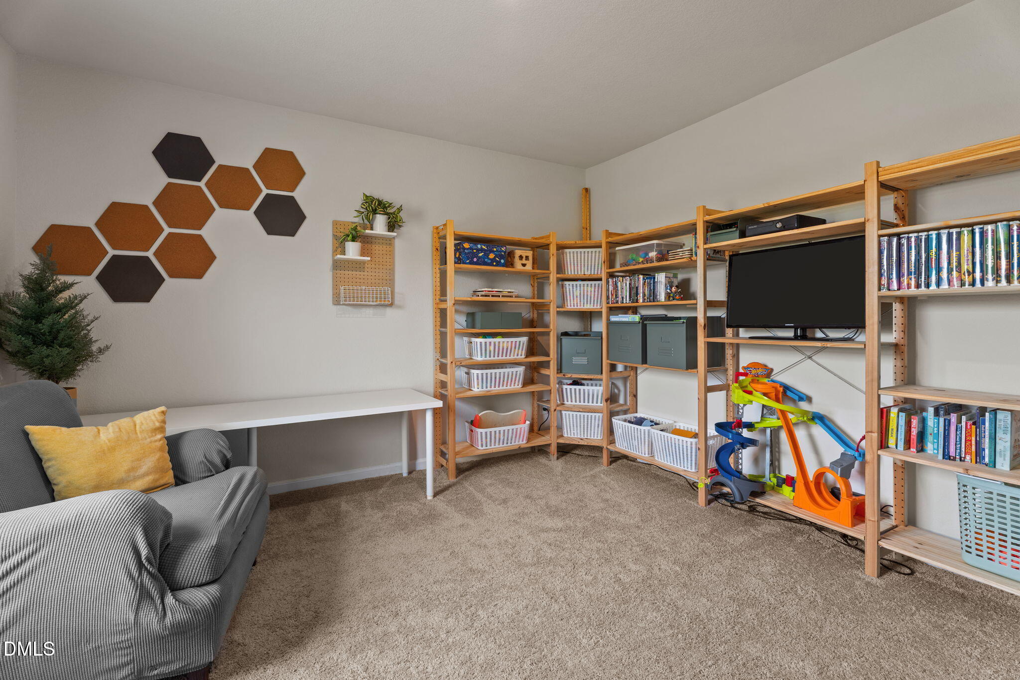357 Gourd Street Zebulon, NC 27597 - Photo 35 of 50 a view of a livingroom with furniture and toys