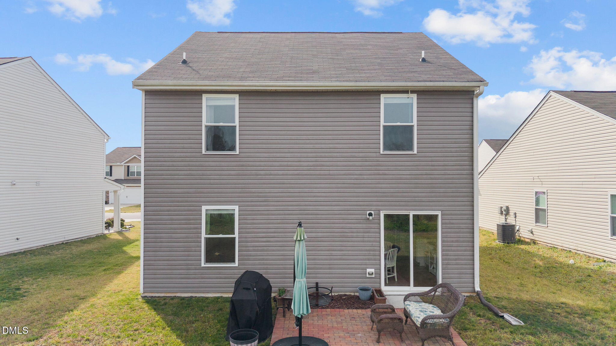 357 Gourd Street Zebulon, NC 27597 - Photo 42 of 50 a view of backyard of house with seating space