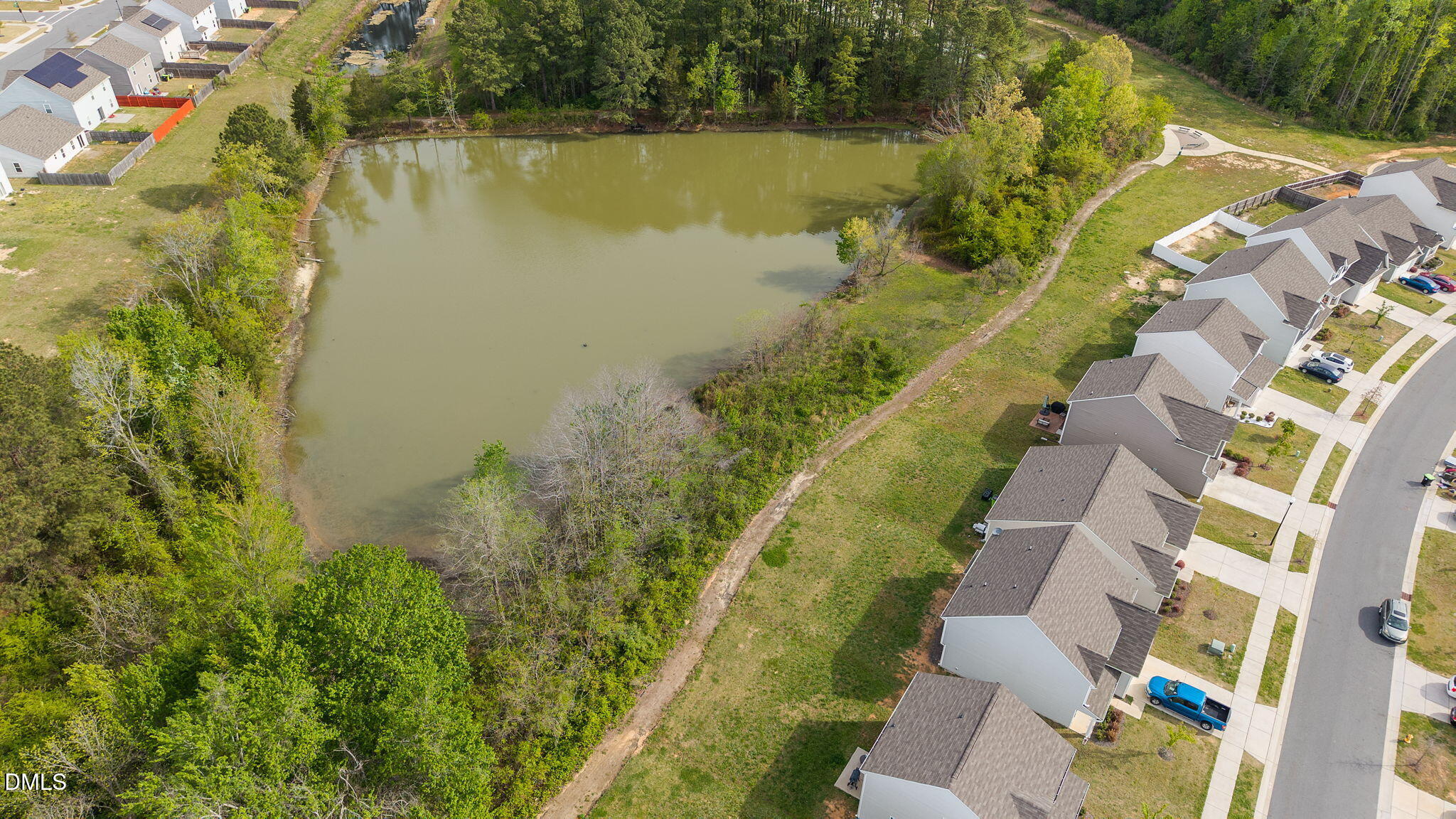 357 Gourd Street Zebulon, NC 27597 - Photo 45 of 50 a view of a lake with a building in the background