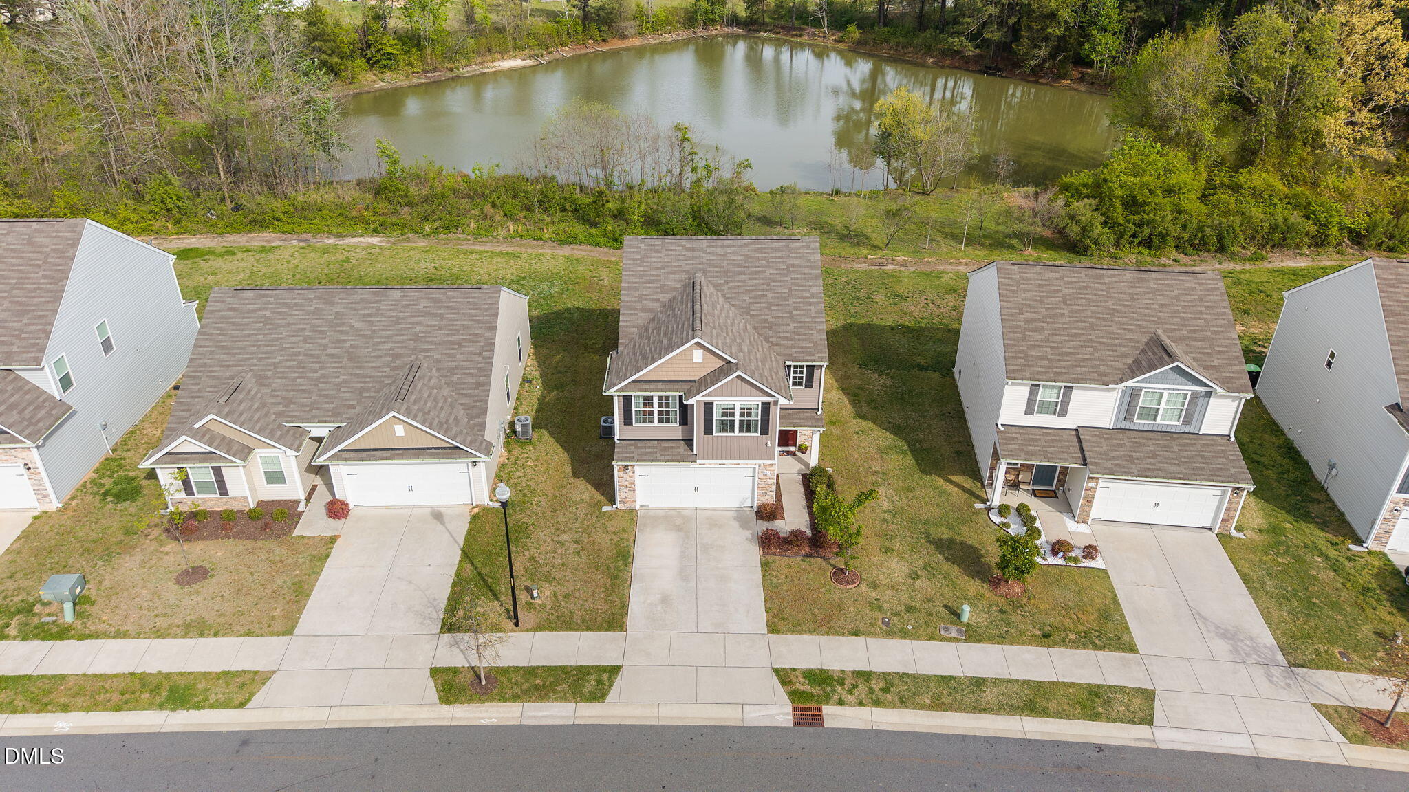 357 Gourd Street Zebulon, NC 27597 - Photo 46 of 50 an aerial view of a house with a yard and lake view