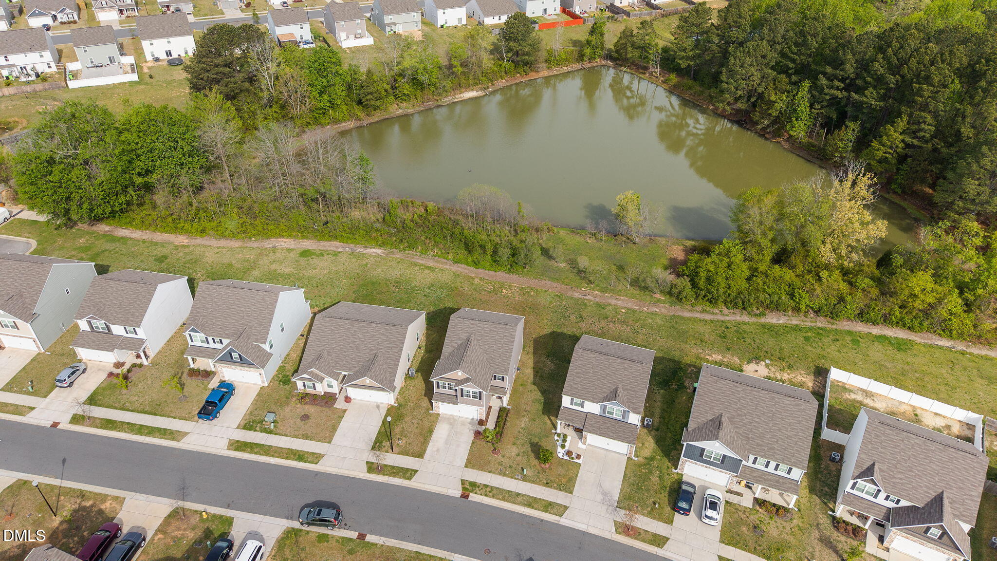 357 Gourd Street Zebulon, NC 27597 - Photo 48 of 50 a view of a lake with a yard from a balcony