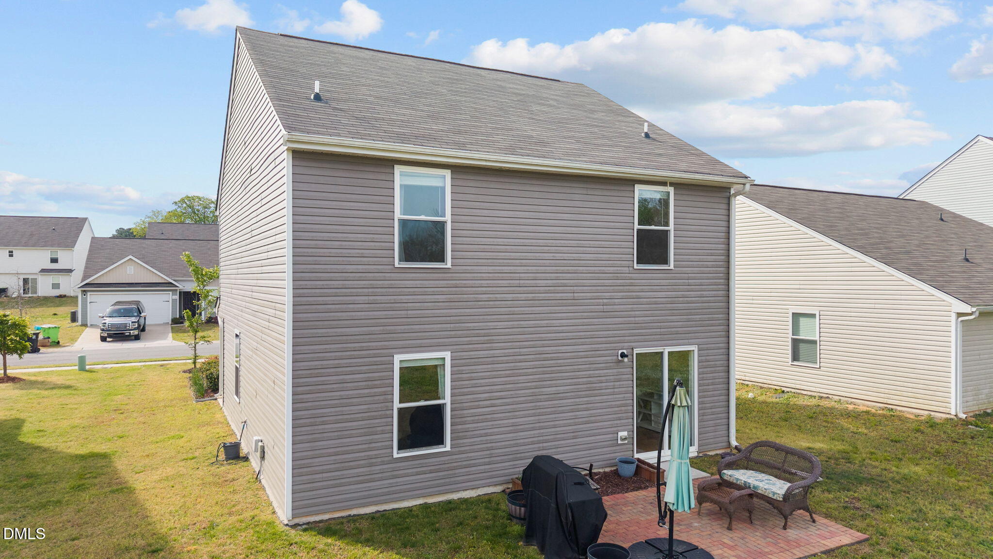 357 Gourd Street Zebulon, NC 27597 - Photo 7 of 50 a view of backyard of house with seating space