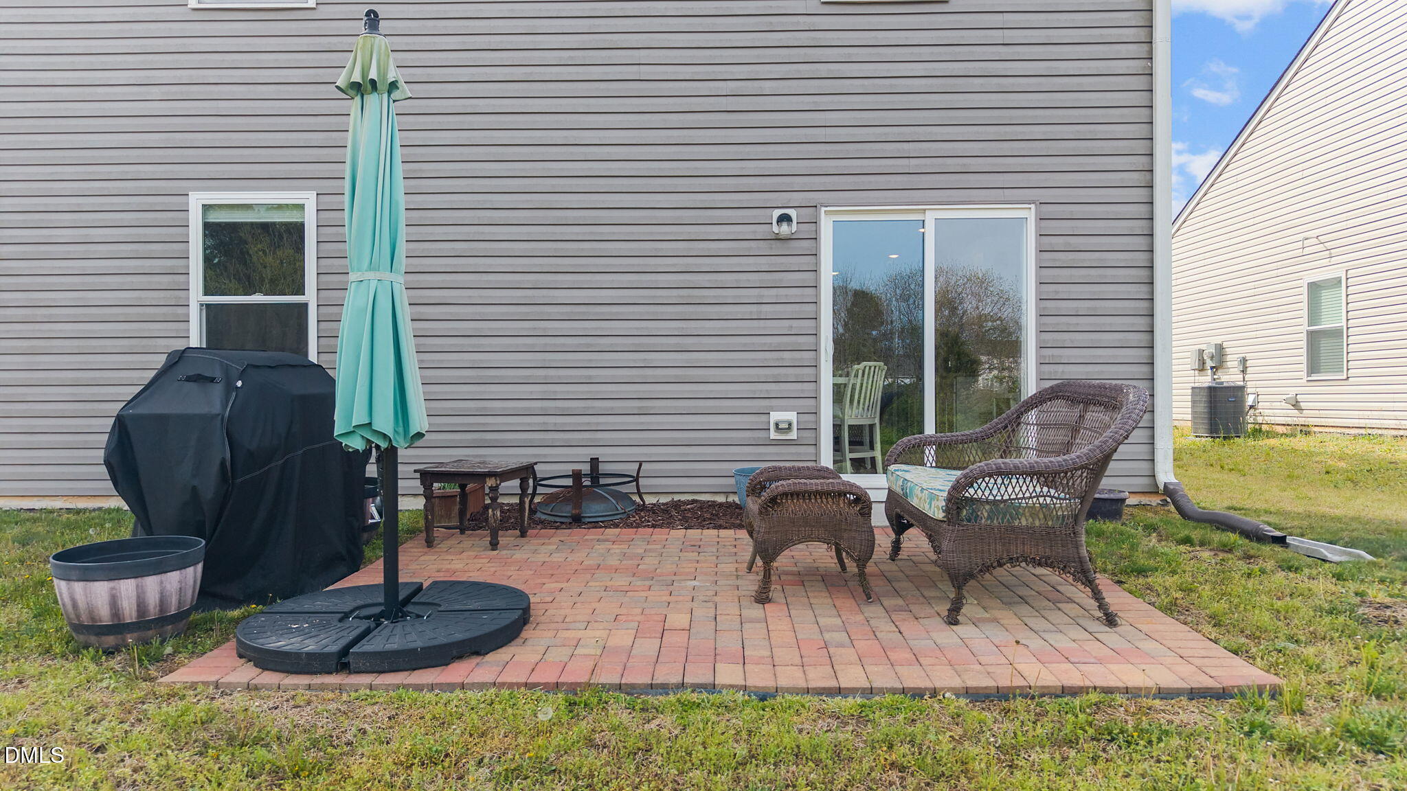 357 Gourd Street Zebulon, NC 27597 - Photo 8 of 50 a view of a backyard with plants and a patio