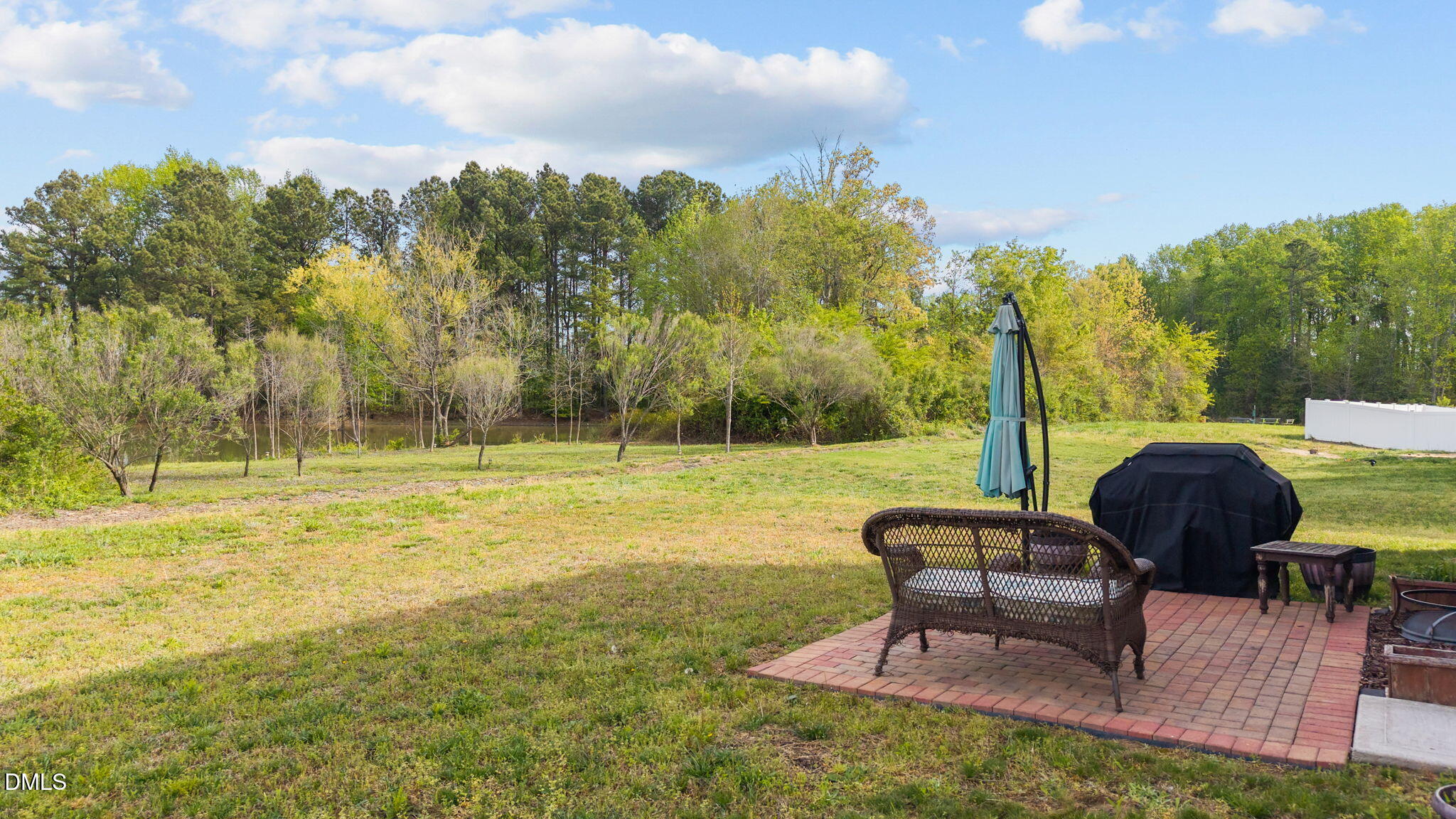 357 Gourd Street Zebulon, NC 27597 - Photo 10 of 50 a view of a garden with a patio
