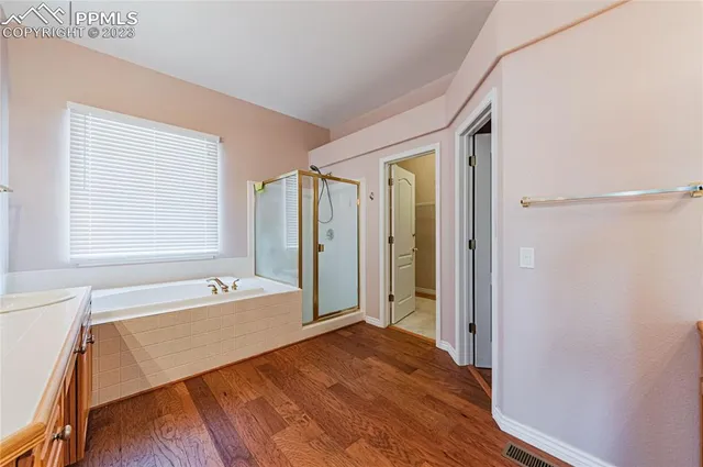 a bathroom with a tub and a sink