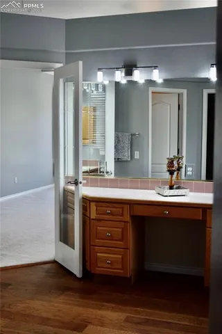 a bathroom with a double vanity sink and mirror