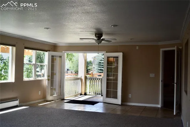 a view of an empty room with a floor to ceiling window and floor to ceiling window