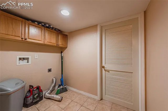 a view of a storage & utility room with closet wooden floor