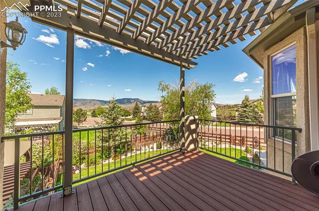a view of balcony with wooden floor
