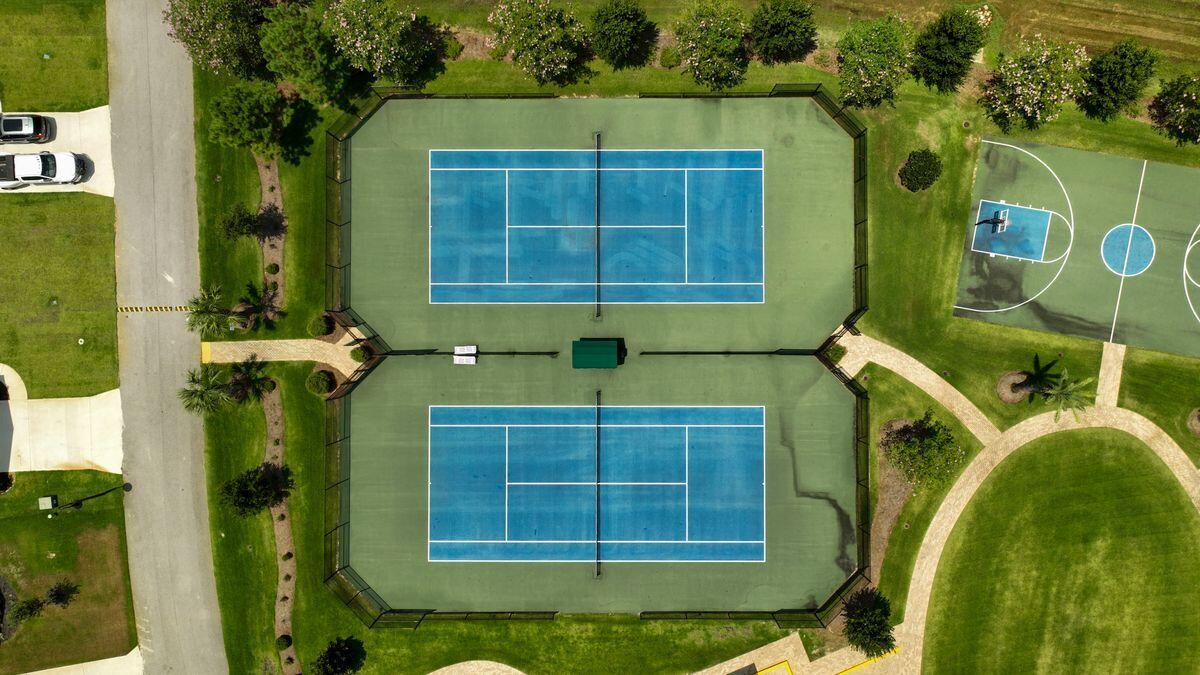 Lot 54 Hibernate Way Freeport, FL 32439 - Photo 9 of 13 a front view of a house with a yard