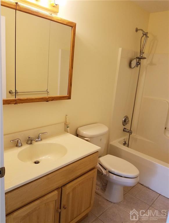 26 Baxter Road Edison, NJ 08817 - Photo 14 of 22 a bathroom with a sink a toilet and shower