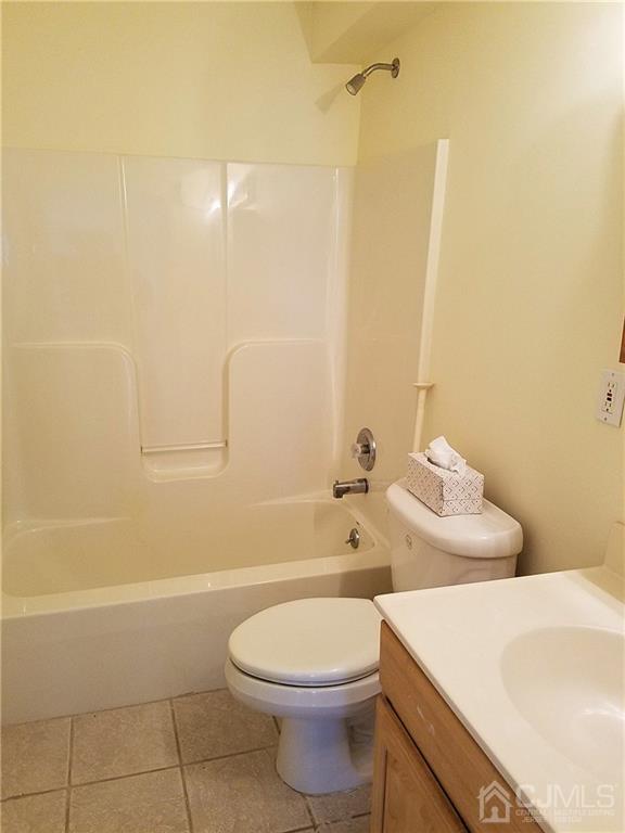 26 Baxter Road Edison, NJ 08817 - Photo 19 of 22 a bathroom with a toilet sink and shower