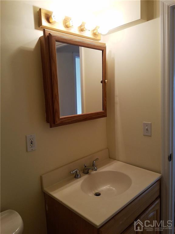 26 Baxter Road Edison, NJ 08817 - Photo 20 of 22 a bathroom with a sink and a toilet