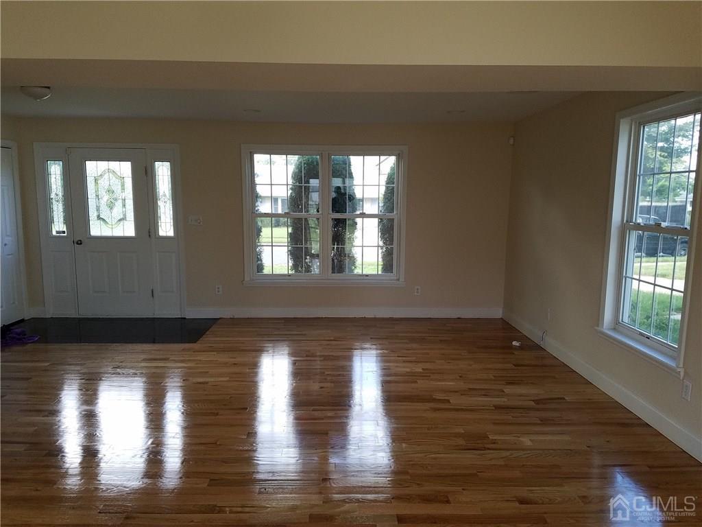 26 Baxter Road Edison, NJ 08817 - Photo 2 of 22 a view of empty room with wooden floor and fan