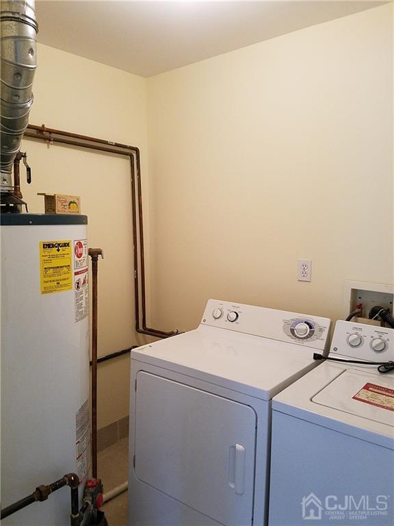 26 Baxter Road Edison, NJ 08817 - Photo 21 of 22 a utility room with dryer and washer