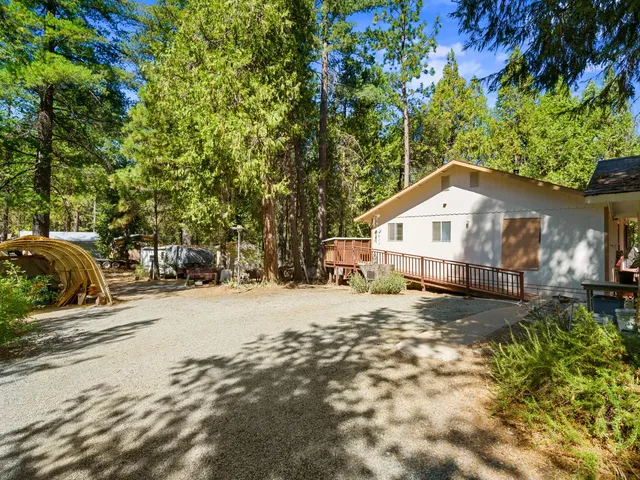 a view of a couches and a fire pit in the patio