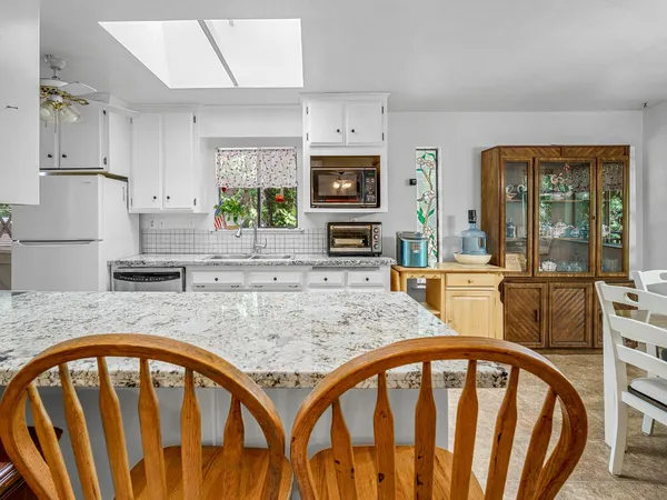 a kitchen that has a sink and a stove