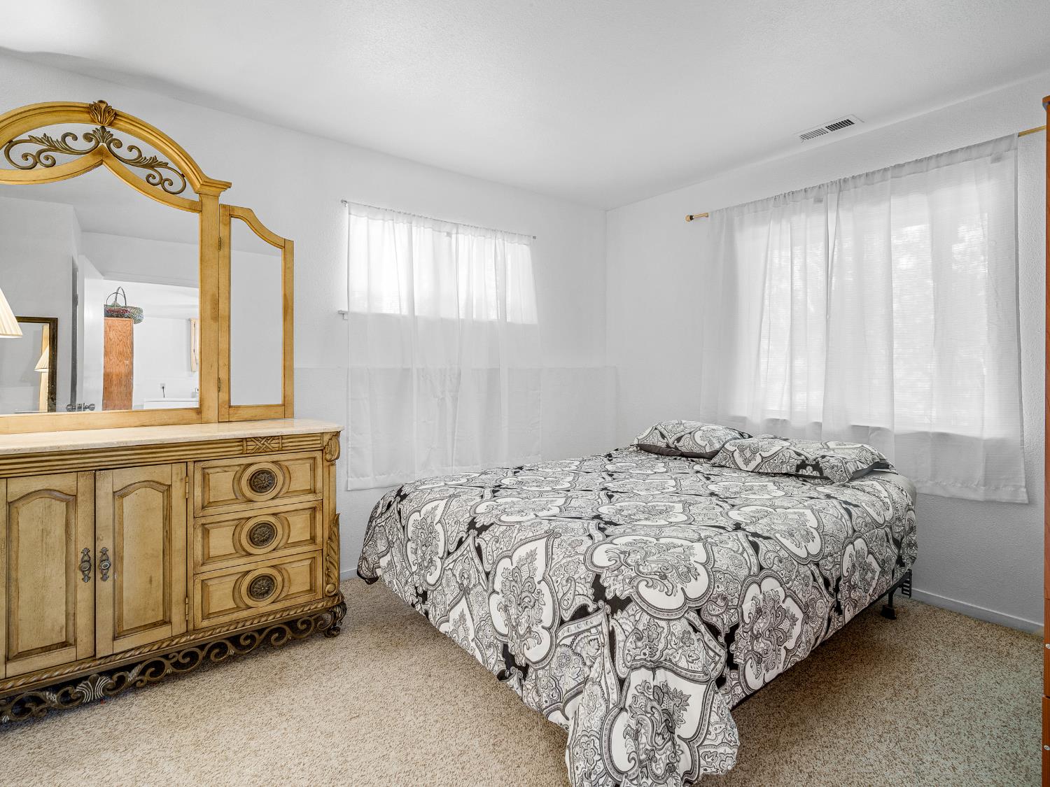 18960 Quailrun Fiddletown, CA 95629 - Photo 9 of 32 a bedroom with a bed and a window