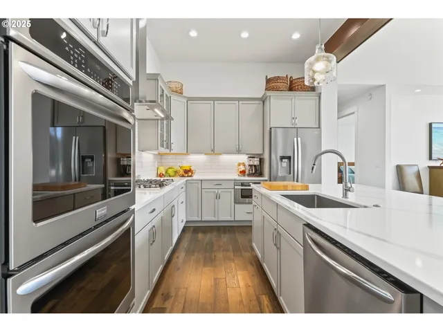 a kitchen with lot of white cabinets
