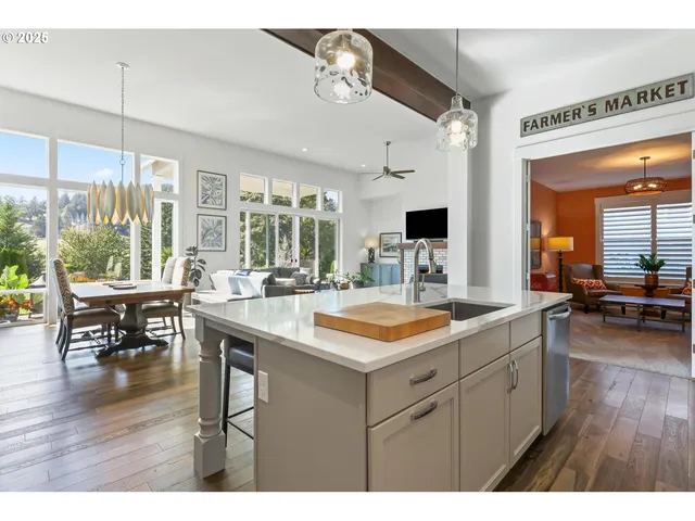 a open kitchen with stainless steel appliances granite countertop a sink and cabinets