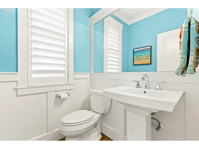 a bathroom with a sink a mirror and a toilet