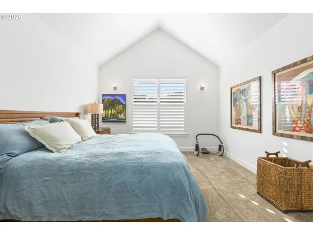 a bedroom with a bed and dresser