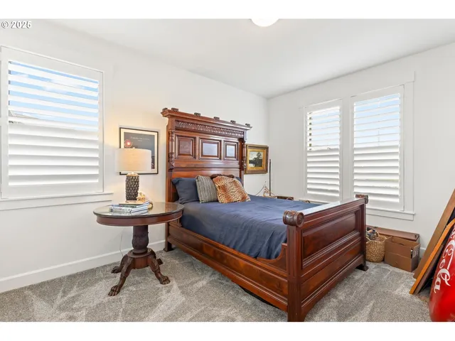 a bed room with a bed and a table