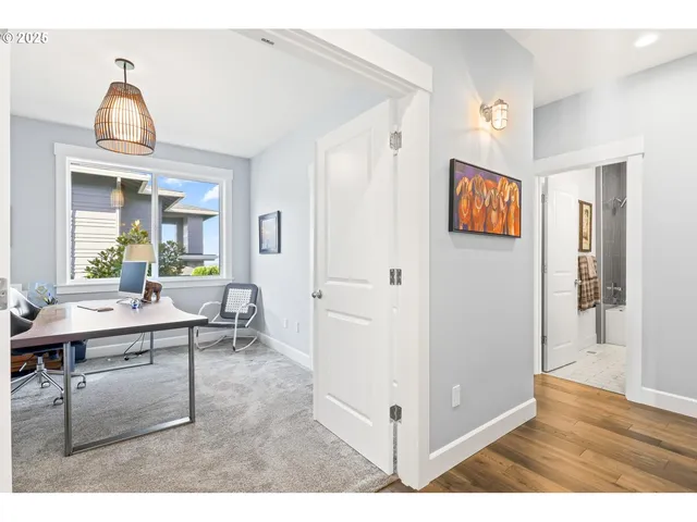 a view of a livingroom with furniture and wooden floor