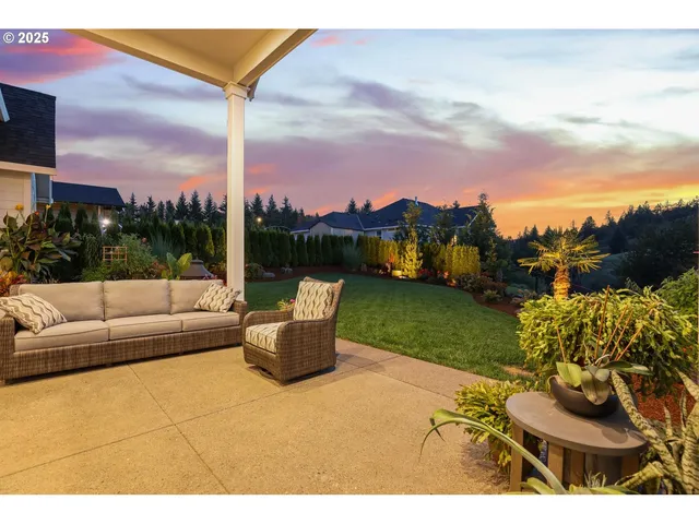a view of a terrace with couches and city view
