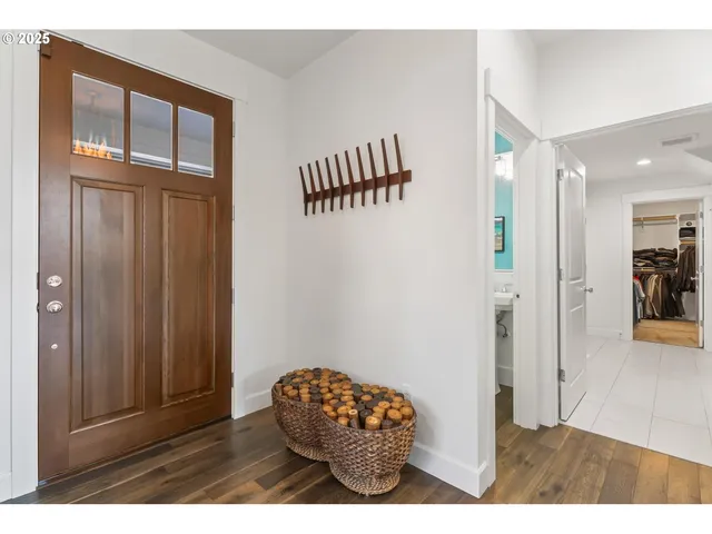 a view of entryway with wooden floor