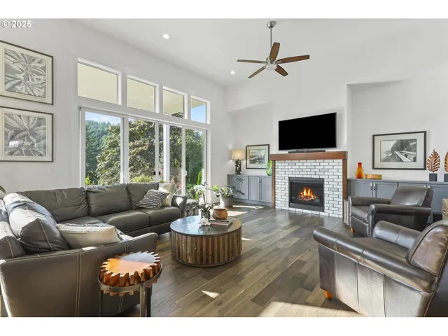 a living room with furniture fireplace and a flat screen tv