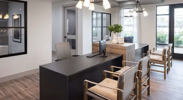 a dining room with furniture and wooden floor