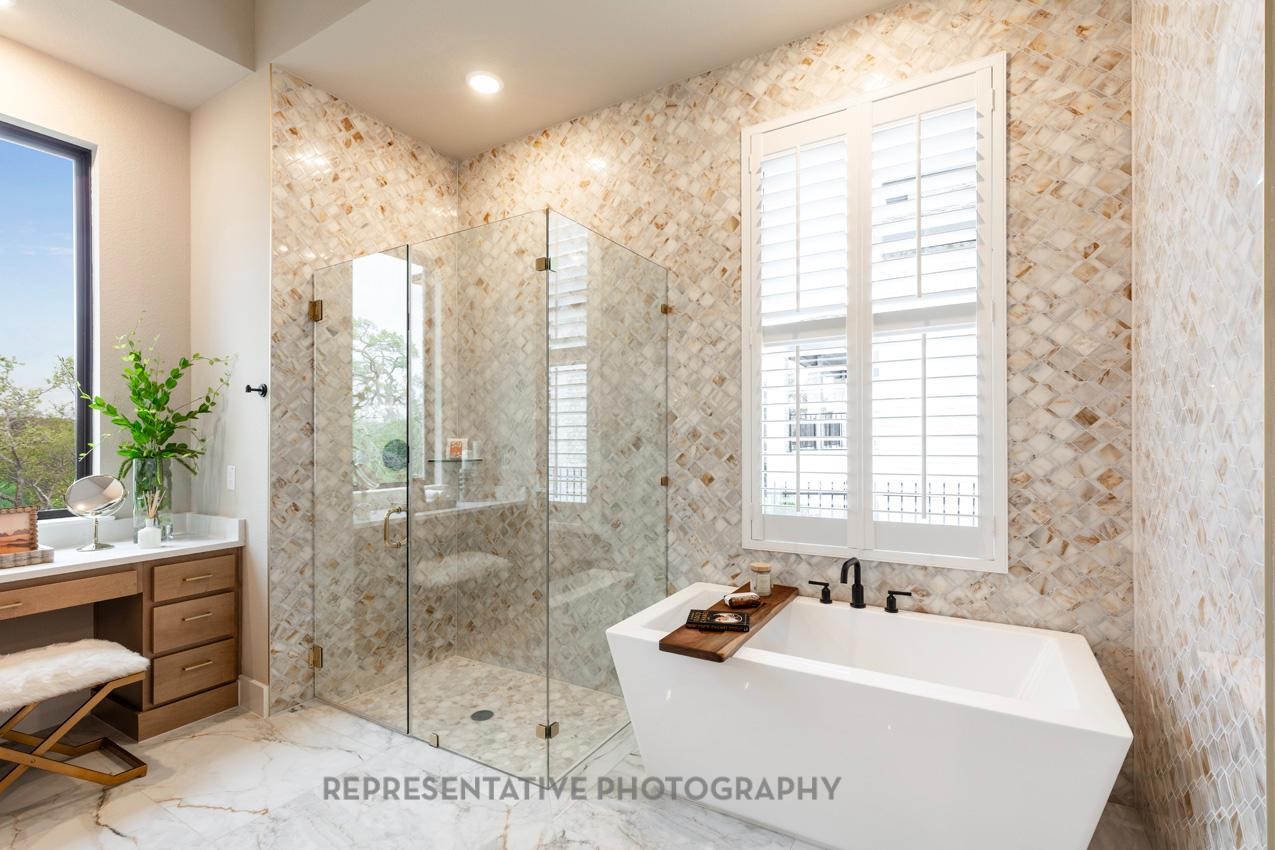 8911 Blue Grotto Lane Manvel, TX 77578 - Photo 13 of 34 a spacious bathroom with sink shower and a bathtub
