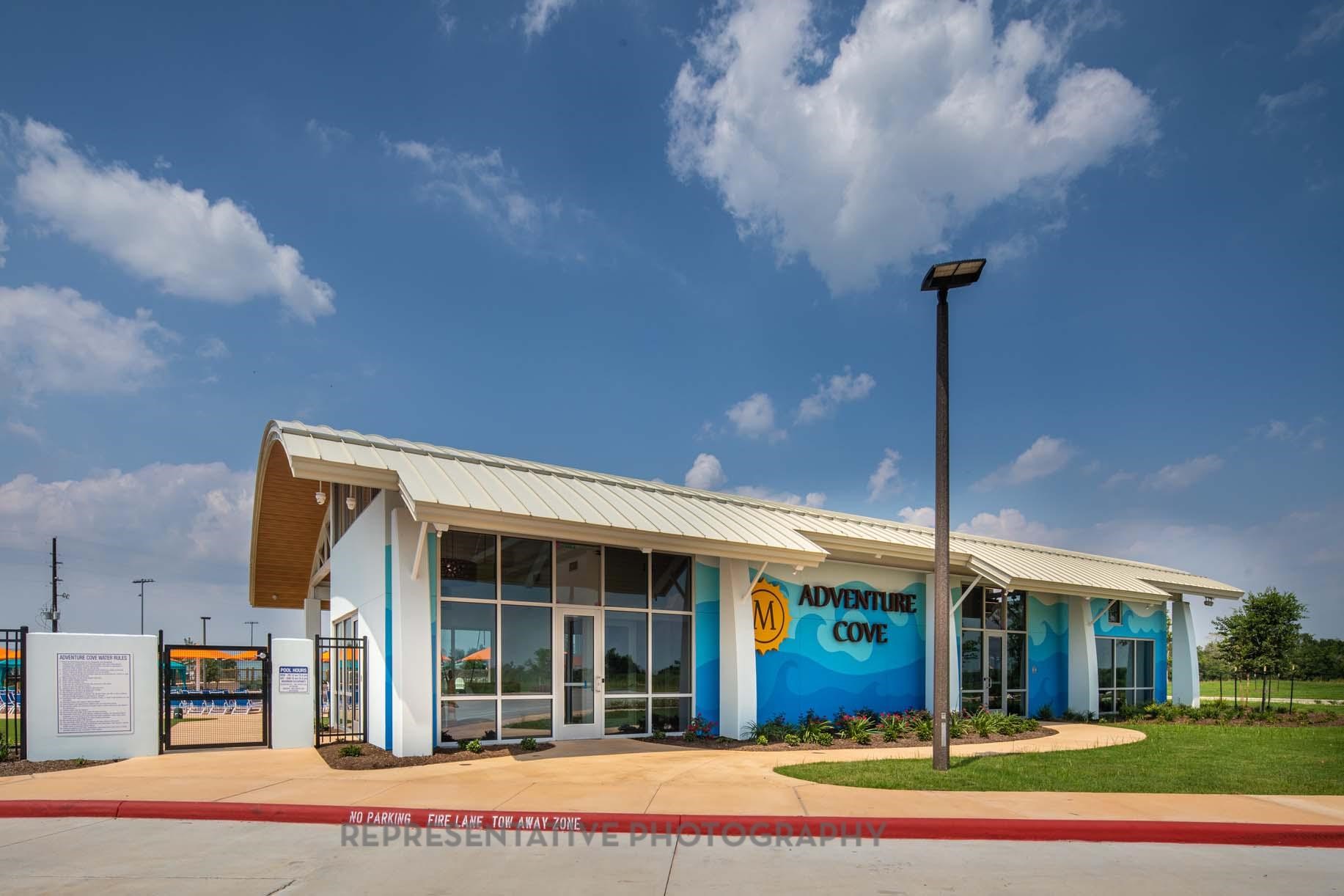 8911 Blue Grotto Lane Manvel, TX 77578 - Photo 30 of 34 a front view of a building with a garden