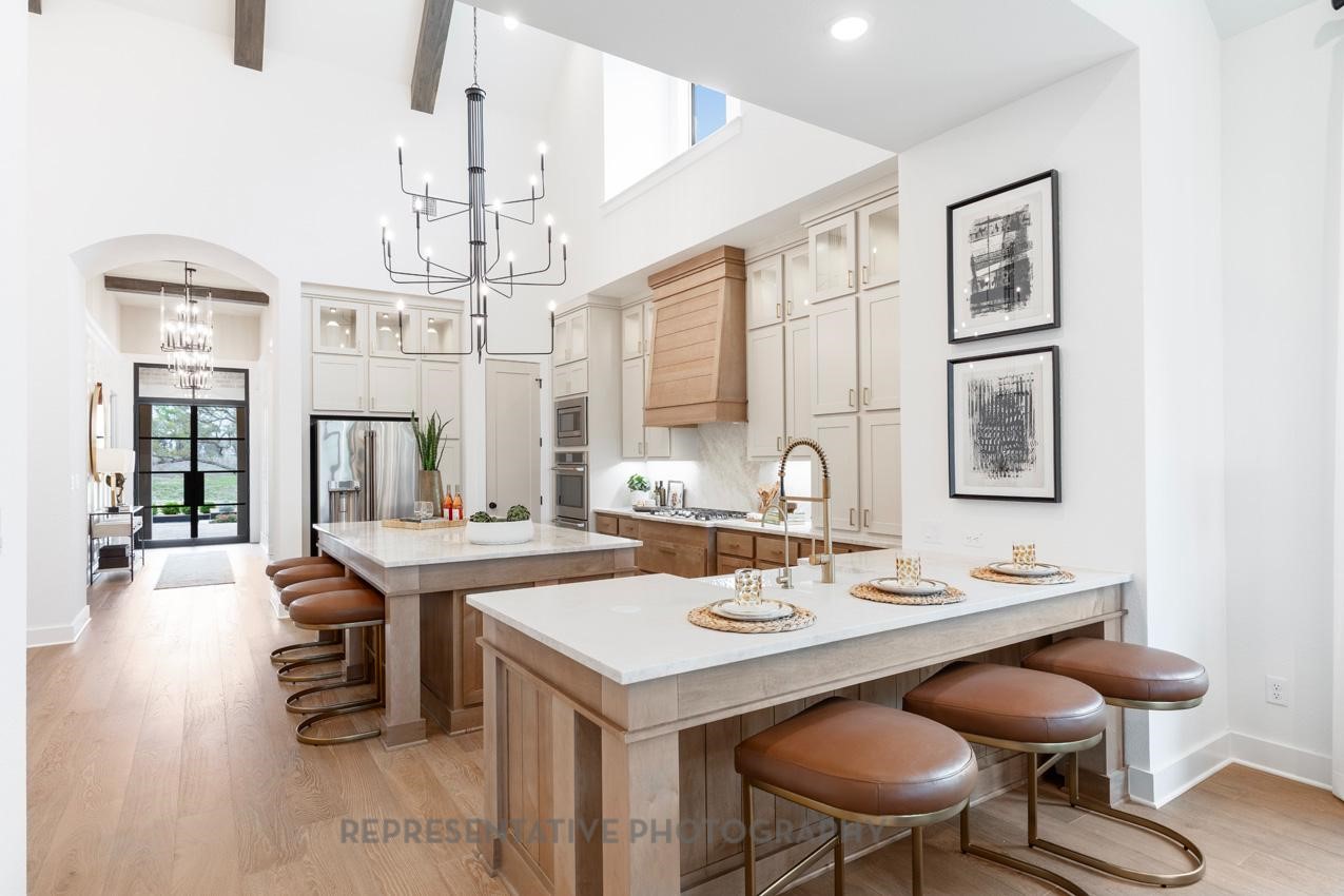 8911 Blue Grotto Lane Manvel, TX 77578 - Photo 9 of 34 a view of a dining room with furniture and chandelier