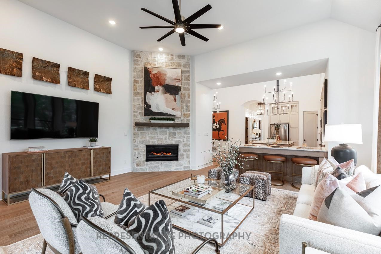 8911 Blue Grotto Lane Manvel, TX 77578 - Photo 10 of 34 a living room with furniture fireplace and flat screen tv