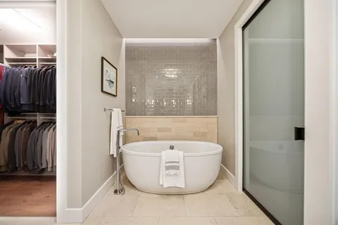a bathroom with a bathtub and shower