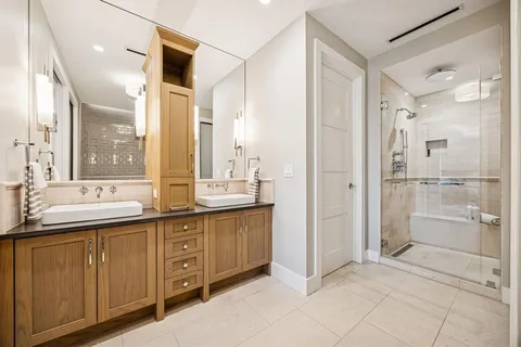 a bathroom with a granite countertop sink mirror and double