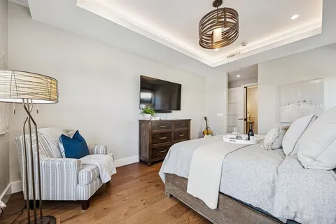 a bedroom with a bed and a couch