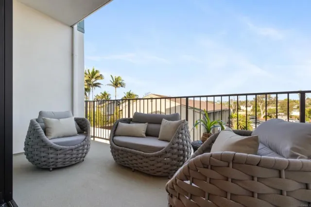 a kitchen with kitchen island a counter space a sink appliances and cabinets