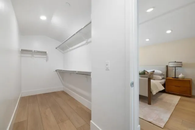 a bedroom with bed and a window