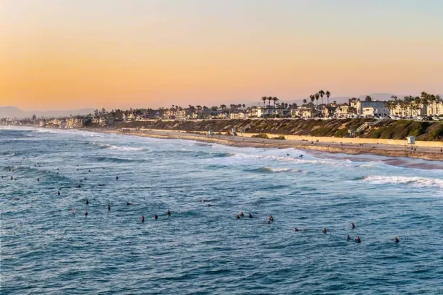 an aerial view of residential building and ocean view